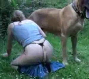 Thong-wearing slut seducing a dog outdoors