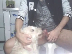 Zoophile has a dog sucking on that juicy boner